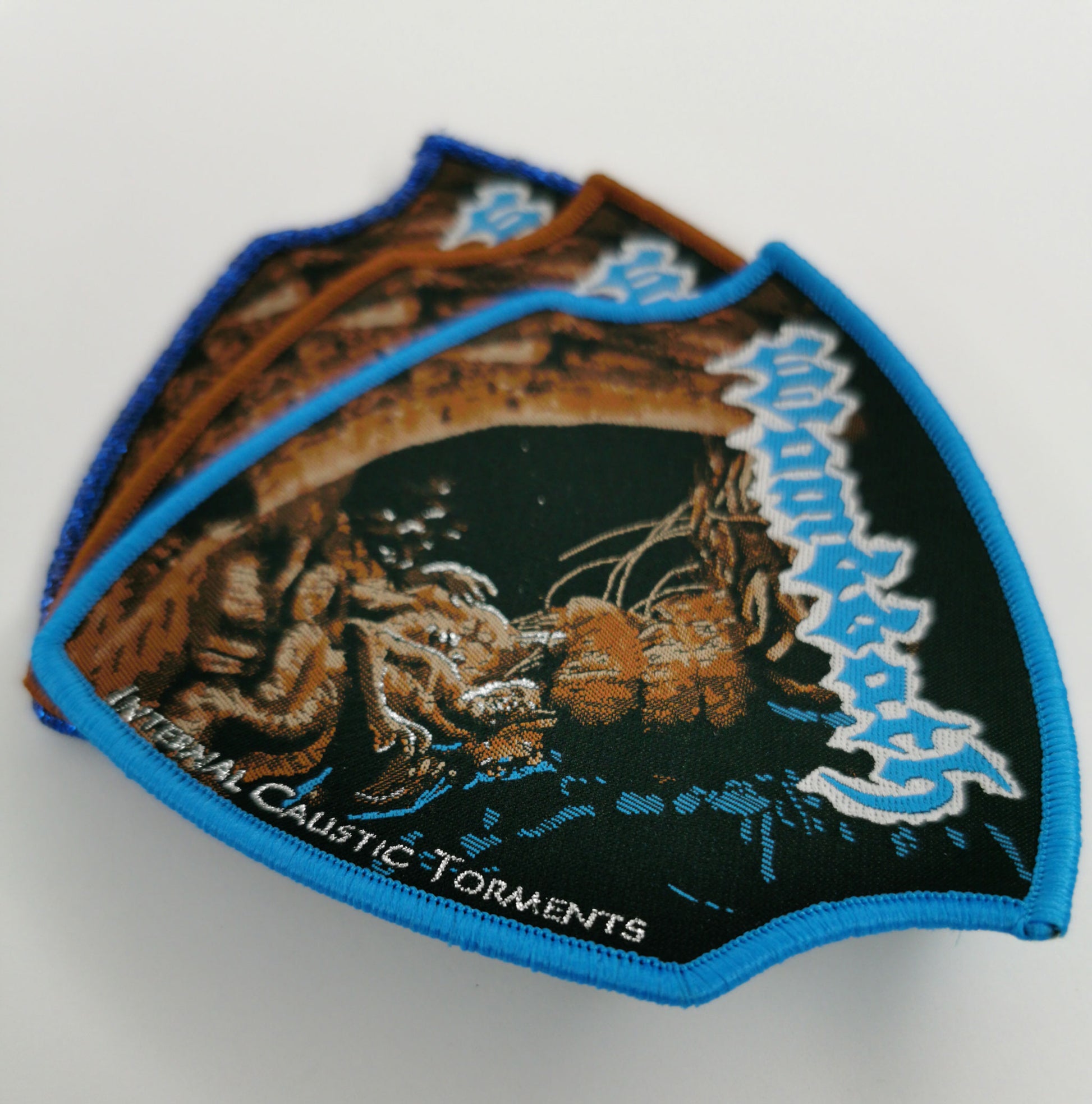 Wombbath Internal Caustic Torments Blue Glitter, Blue and Brown Border Woven Metal Patches Old School Death Metal