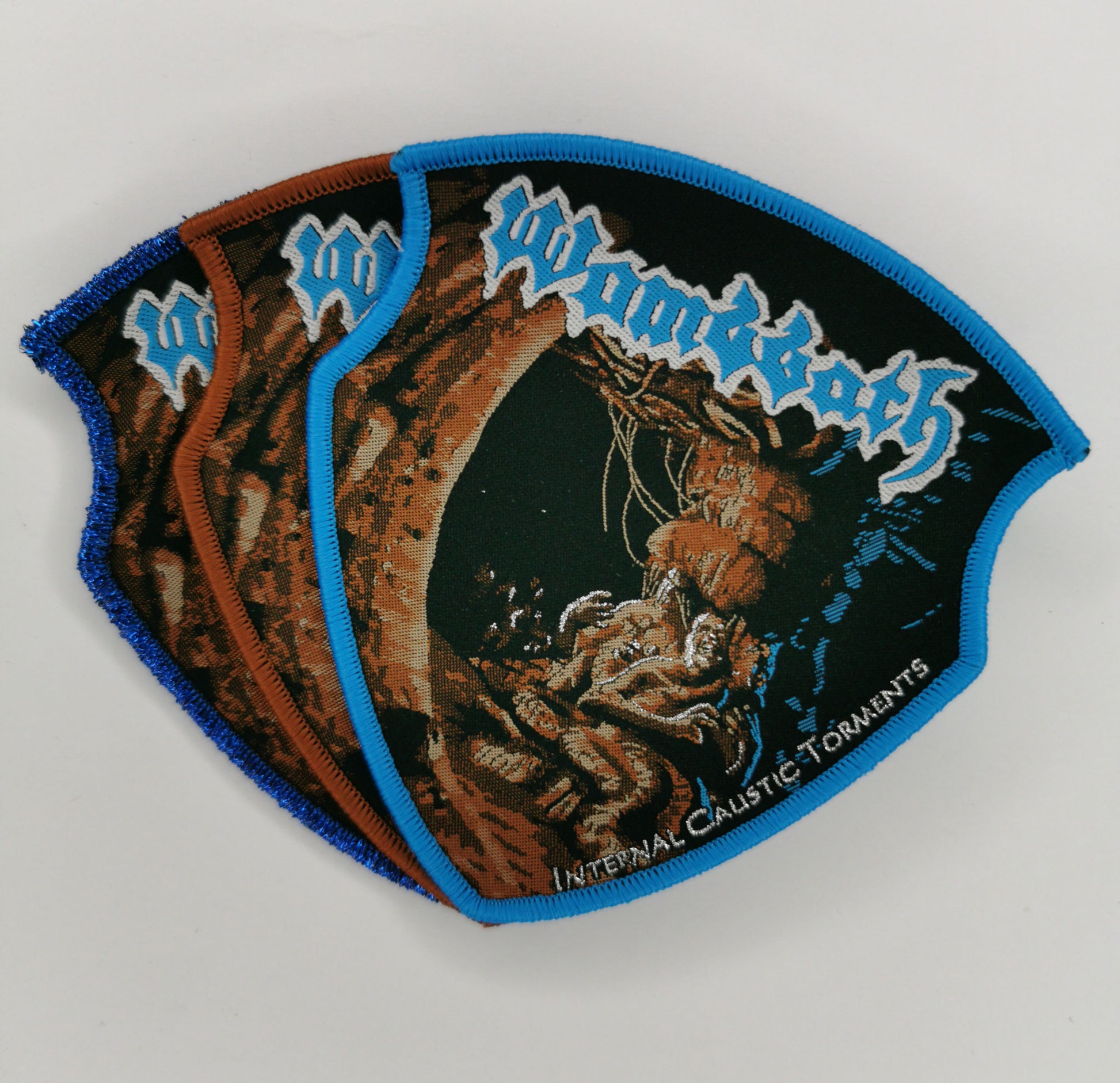Wombbath Internal Caustic Torments Blue Glitter, Blue and Brown Border Woven Patches Old School Death Metal