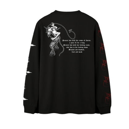 A black long-sleeve t-shirt shown from the back, featuring a white graphic of a horned devil figure with a whip and a block of gothic text. The right sleeve has white barbed wire graphics, and the left sleeve has red gothic script graphics.