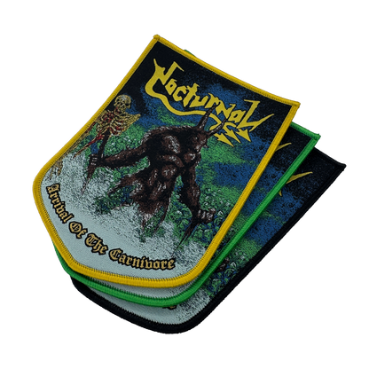 A stack of three metal band patches for the band 'Nocturnal', featuring the album artwork 'Arrival of the Carnivore'. The top patch is displayed flat, showing a skeleton and a dark creature on a green and blue background with yellow borders.