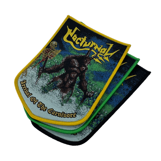 A stack of three metal band patches for the band 'Nocturnal', featuring the album artwork 'Arrival of the Carnivore'. The top patch is displayed flat, showing a skeleton and a dark creature on a green and blue background with yellow borders.