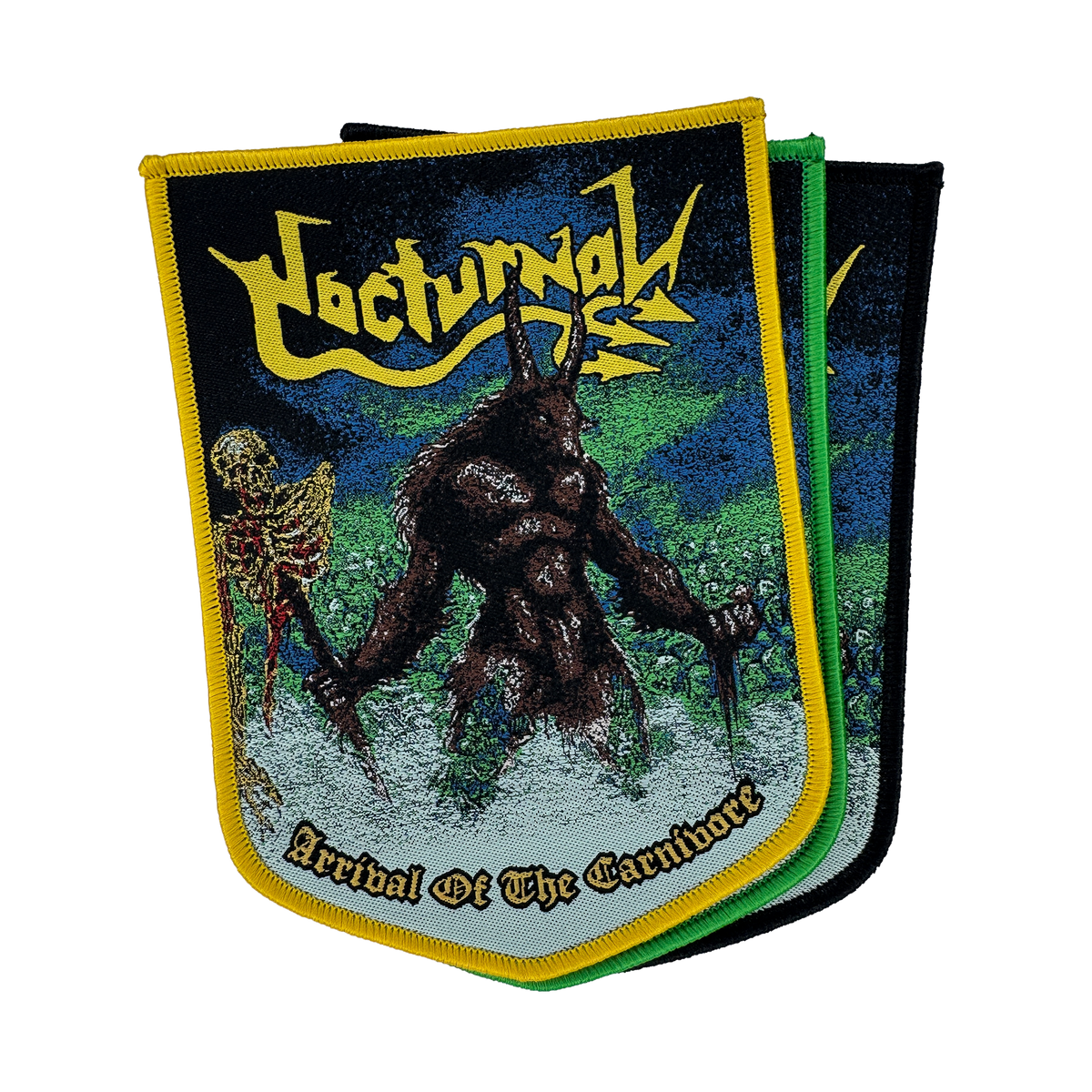 A metal band patch for 'Nocturnal' featuring a dark, hairy monster holding a skeleton, with the text 'Arrival Of The Carnivore' and the band name in yellow. The patch has a yellow border and is shown overlapping two other patches with green and black borders on a white background.