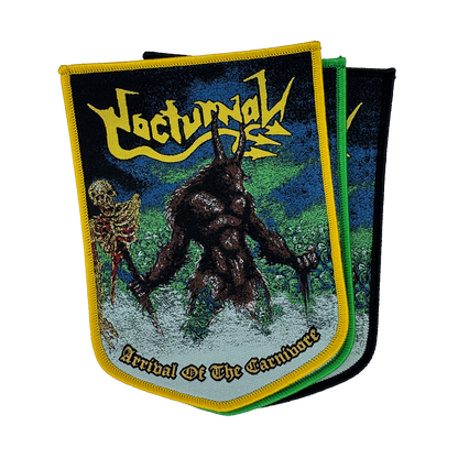 A metal band patch for 'Nocturnal' featuring a dark, hairy monster holding a skeleton, with the text 'Arrival Of The Carnivore' and the band name in yellow. The patch has a yellow border and is shown overlapping two other patches with green and black borders on a white background.